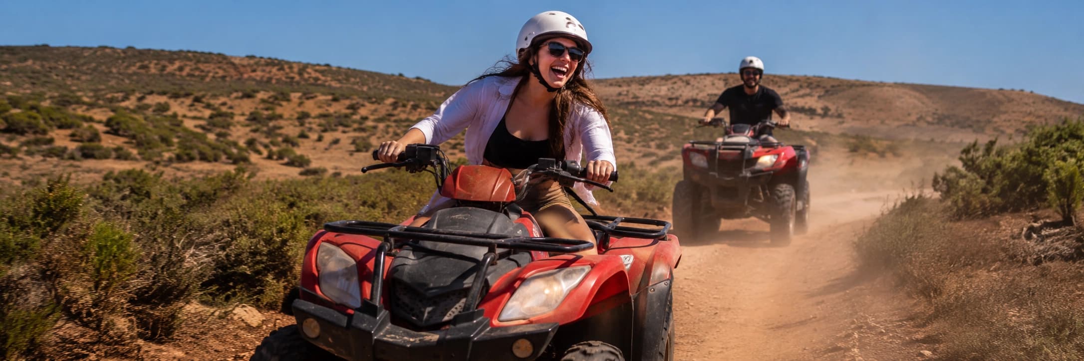 Travellers laughing on a quad trail